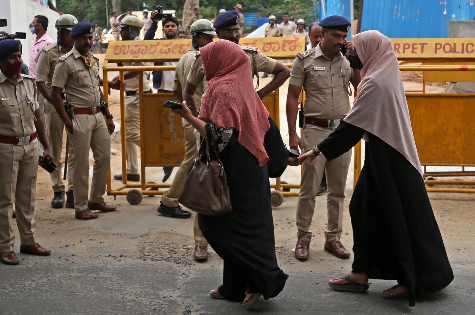 Indian Muslim women stand in front of police personnel during a protest over the hijab ban organized by a Muslim organization in Bengaluru, India, March 26, 2022. (EPA Photo)