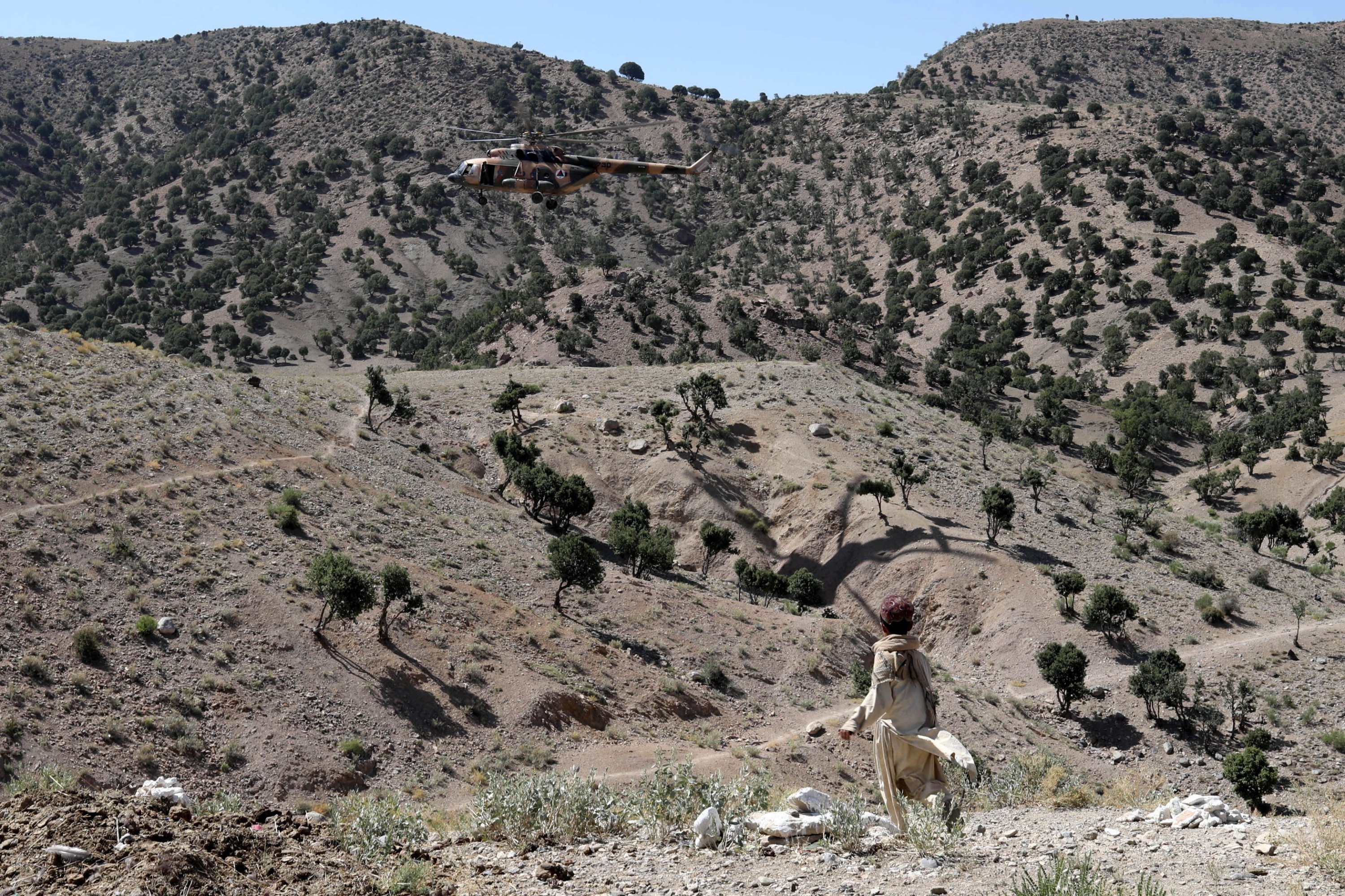 A Taliban helicopter lands in the quake-hit area of Wor Kali village in the Barmal district of Paktika province, Afghanistan, June 25, 2022. (Reuters Photo)