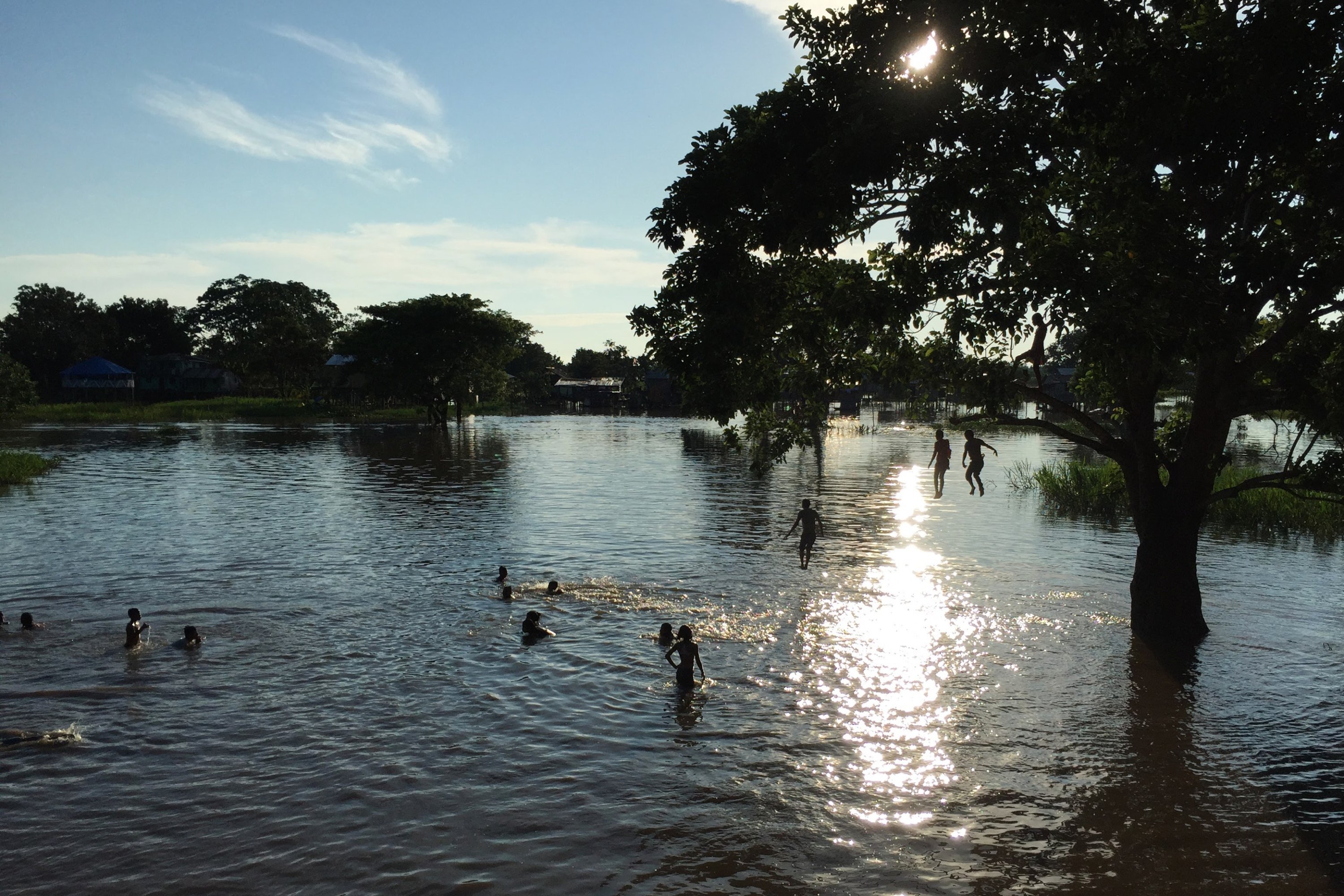 Children play in a flooded area of Leticia, Colombia, Feb. 14, 2017, located by the Amazon river, in the border with Brazil and Peru. (AP File Photo)