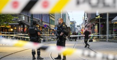 Police stand guard at the site of a mass shooting in Oslo, Norway, June 25, 2022. (AP Photo)