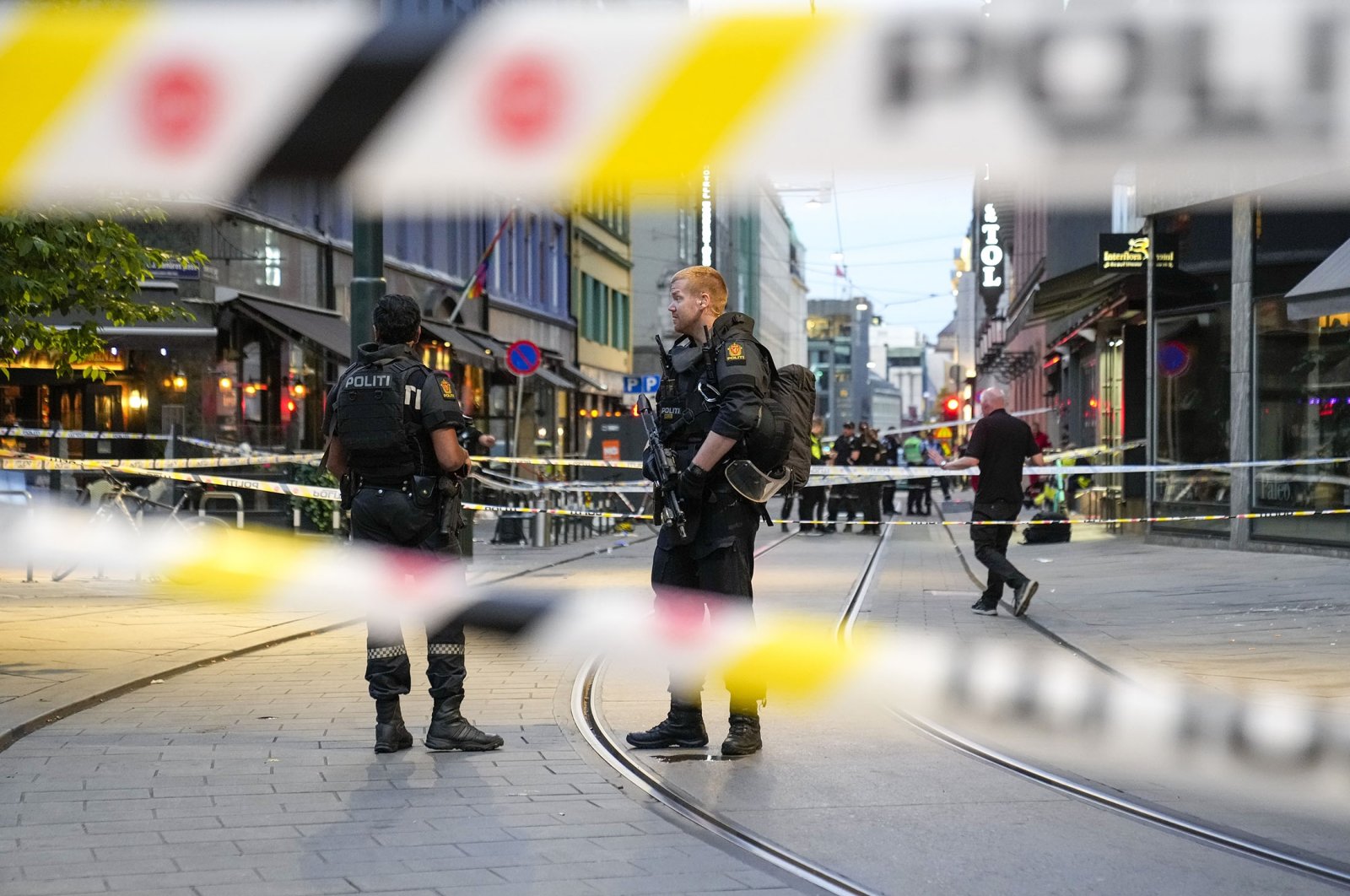 Police stand guard at the site of a mass shooting in Oslo, Norway, June 25, 2022. (AP Photo)