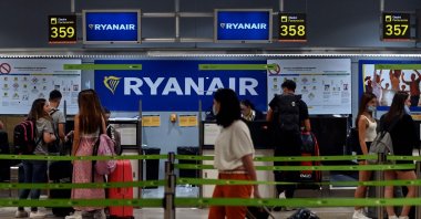 Passengers stand near the Ryanair check-in counters during a strike at Adolfo Suarez Madrid Barajas airport in Madrid, Spain, June 24, 2022. (AFP Photo)