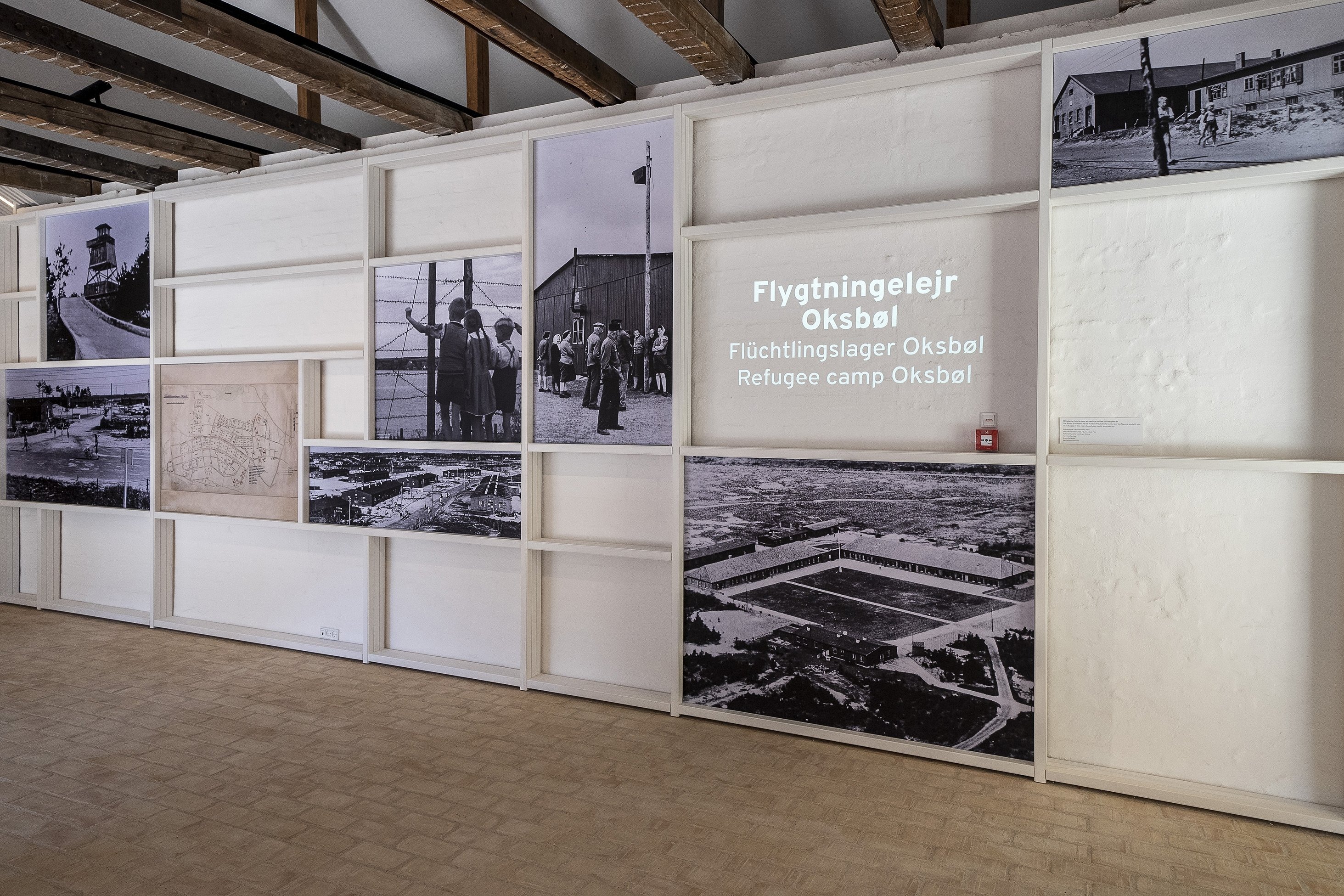 Foto-foto yang dipajang di Flugt (kata Denmark untuk melarikan diri) sebuah museum baru untuk cerita pengungsi, di Oksboel, Denmark, 24 Juni 2022. (AP Photo)
