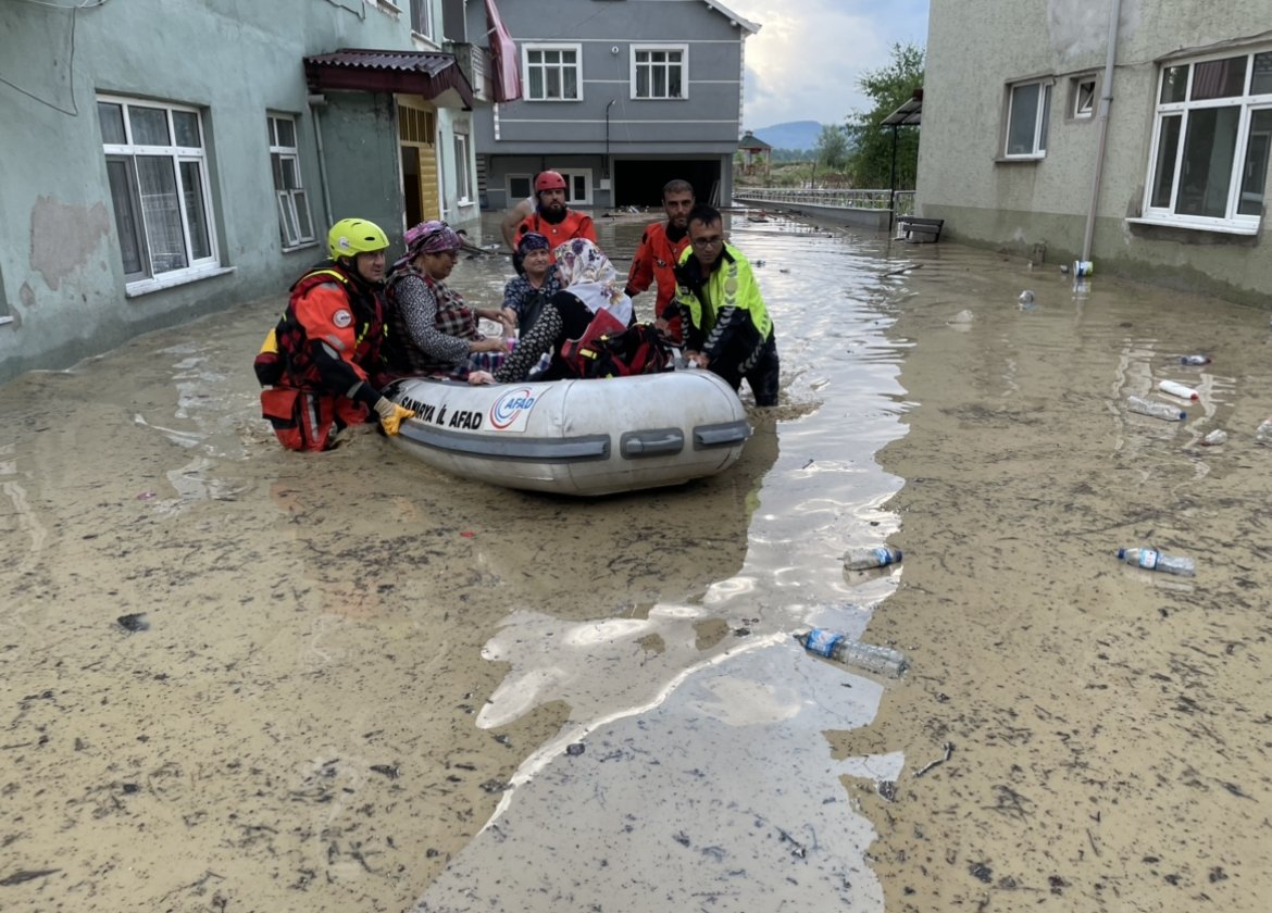 Crews evacuate elderly citizens from a house in a flooded street in Gökçebey, Zonguldak, northern Turkey, Jun. 27, 2022. (AA PHOTO) 