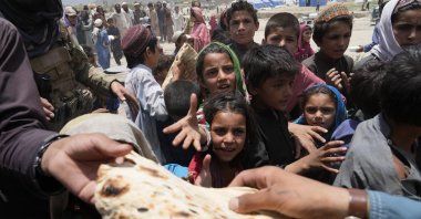 Afghans receive aid at a camp after an earthquake in the Gayan district of Paktika province, Afghanistan, June 26, 2022. (AP Photo)
