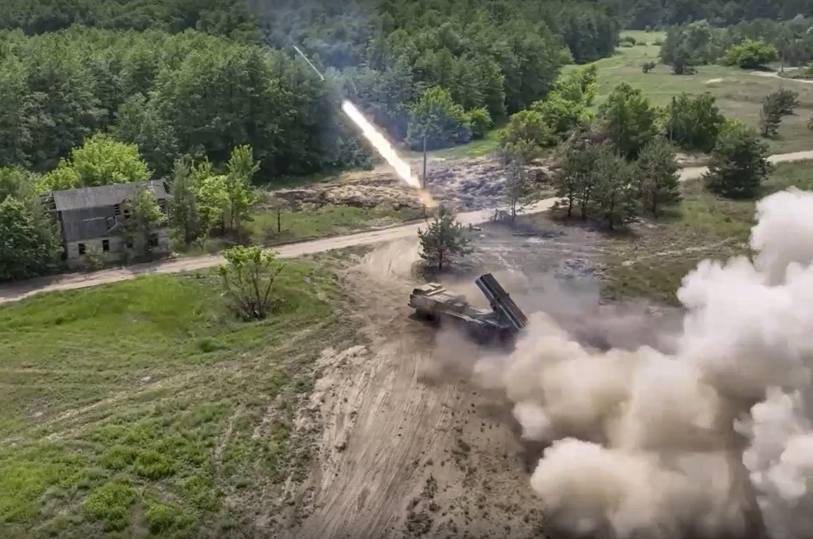 A Russian military&#039;s multiple rocket launcher fires rockets at Ukrainian troops at an undisclosed location, June 25, 2022. (Russian Defense Ministry Press Service via AP)