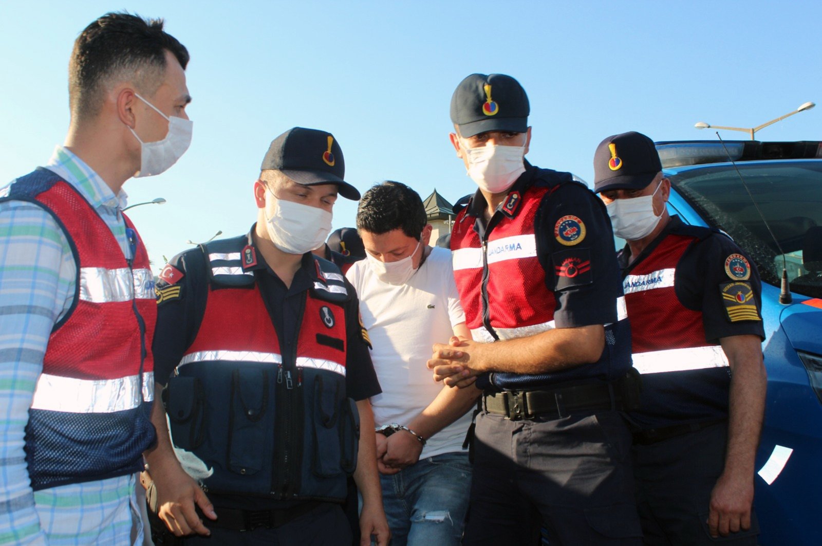 Gendarmerie officers escort C.M.A. in Muğla, southwestern Turkey, July 21, 2020 (IHA Photo)