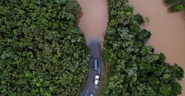 Cars stop before a flooded area after Cyclone Batsirai made landfall on a road in Vohiparara, Madagascar, Feb. 6, 2022. (Reuters Photo)