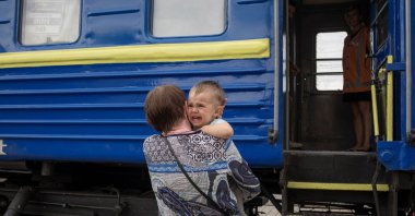 A child cries before boarding a train to Dnipro and Lviv during an evacuation of civilians from war-affected areas of eastern Ukraine, amid Russia's invasion of the country, in Pokrovsk, Donetsk region, Ukraine, June 25, 2022. (Reuters Photo)
