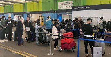 Passengers queue outside Terminal 1 at Manchester Airport, Manchester, U.K., June 1, 2022. (Reuters File Photo)
