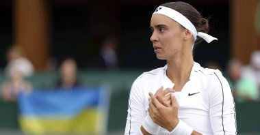 Ukraine's Anhelina Kalinina pauses as she plays against Hungary's Anna Bondar at the Wimbledon, London, England, June 27, 2022. (AP Photo)