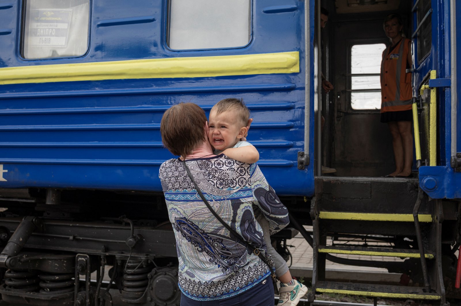 A child cries before boarding a train to Dnipro and Lviv during an evacuation of civilians from war-affected areas of eastern Ukraine, amid Russia&#039;s invasion of the country, in Pokrovsk, Donetsk region, Ukraine, June 25, 2022. (Reuters Photo)