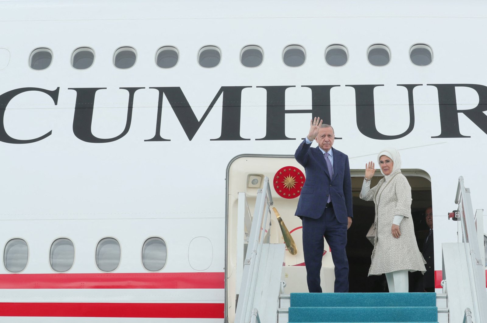 President Recep Tayyip Erdoğan (L) and first lady Emine Erdoğan wave before departing for Spain to attend a NATO summit, at Esenboğa Airport in Ankara, Turkey, June 28, 2022. (REUTERS)