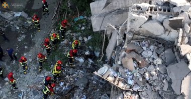 Rescuers work at a residential building hit by a Russian military strike in this screen grab obtained from a handout video, Mykolaiv, Ukraine, June 29, 2022. (State Emergency Service of Ukraine via Reuters)