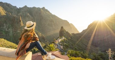 A tourist admires Masca village, Spain at sunset. (Getty Images) 