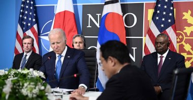 U.S. President Joe Biden (2L) flanked by U.S. Secretary of Defense Lloyd Austin (R), Secretary of State Antony Blinken (2L) and U.S. National Security Advisor Jake Sullivan (L) sits with Japan's Prime Minister Fumio Kishida (2R) and South Korea's President during a trilateral meeting on the sidelines of the NATO summit at the Ifema congress center, Madrid, Spain, June 29, 2022. (AFP Photo)