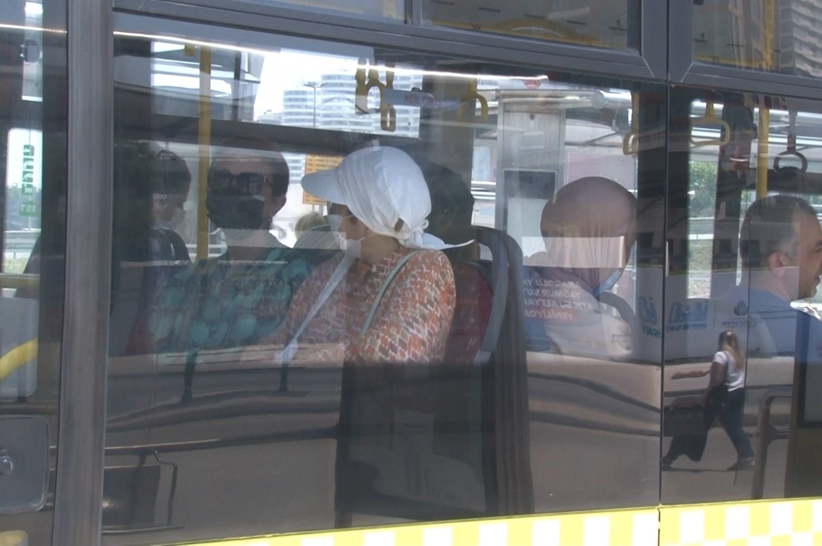 People wearing protective masks against COVID-19 in a bus, in Istanbul, Turkey, May 30, 2022. (İHA PHOTO) 