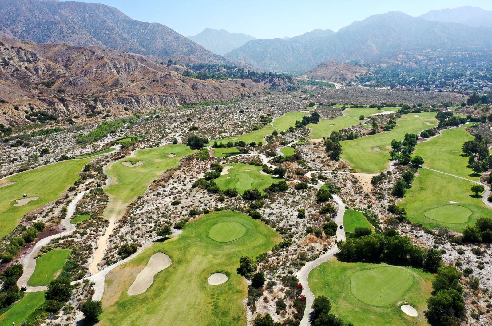 An aerial view of the Angeles National Golf Club, a public facility in the Sunland neighborhood where drought restrictions are being imposed on golf courses, Los Angeles, California, U.S., June 14, 2022. (AFP Photo)