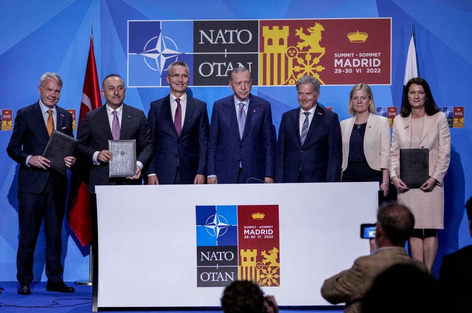 From left to right, Finnish Foreign Minister Pekka Haavisto, Turkish Foreign Minister Mevlüt Çavuşoğlu, NATO Secretary-General Jens Stoltenberg, Turkish President Recep Tayyip Erdoğan, Finland&#039;s President Sauli Niinisto, Sweden&#039;s Prime Minister Magdalena Andersson and Sweden&#039;s Foreign Minister Ann Linde pose for a picture after signing a memorandum in which Turkey agrees to Finland and Sweden&#039;s membership of the defense alliance in Madrid, Spain, June 28, 2022. (AP Photo)