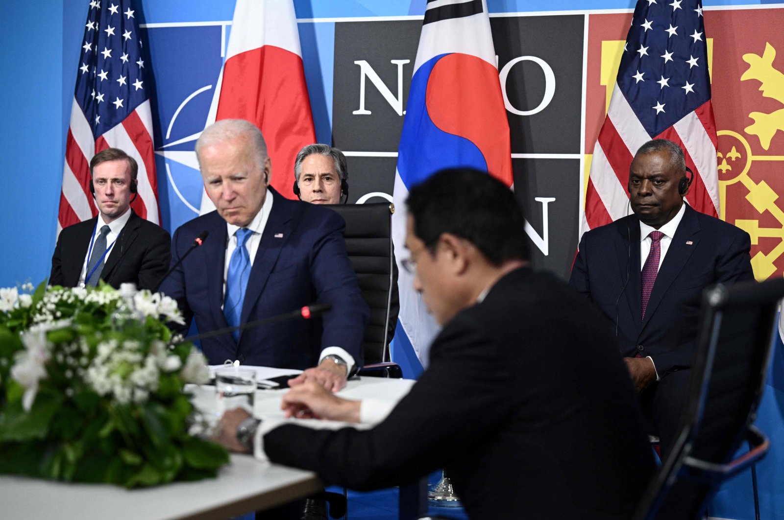 U.S. President Joe Biden (2L) flanked by U.S. Secretary of Defense Lloyd Austin (R), Secretary of State Antony Blinken (2L) and U.S. National Security Advisor Jake Sullivan (L) sits with Japan&#039;s Prime Minister Fumio Kishida (2R) and South Korea&#039;s President during a trilateral meeting on the sidelines of the NATO summit at the Ifema congress center, Madrid, Spain, June 29, 2022. (AFP Photo)