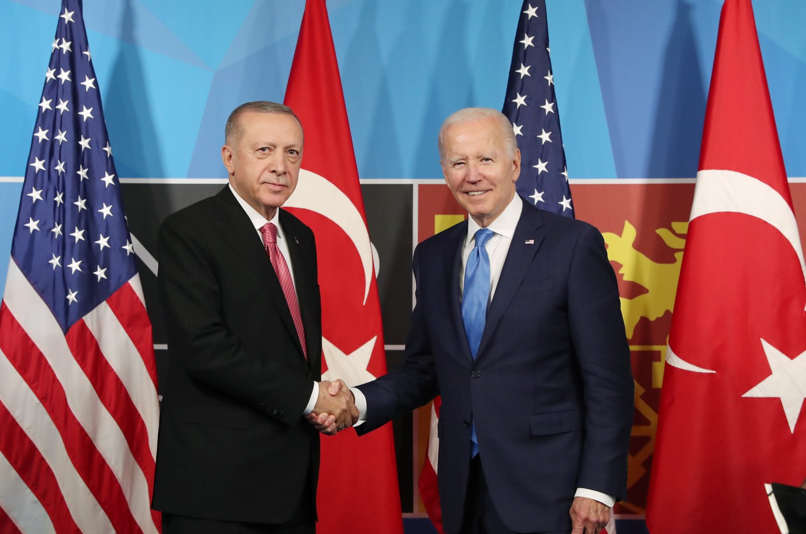 President Recep Tayyip Erdoğan and U.S. President Joe Biden shake hands at their meeting held on the sidelines of the NATO Summit in Madrid, Spain, June 29, 2022. (DHA Photo)