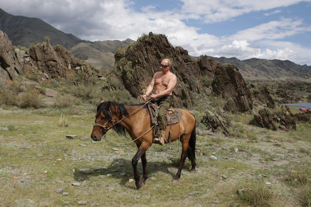 Then Russian Prime Minister Vladimir Putin rides a horse while traveling in the mountains of the Siberian Tyva region (also referred to as Tuva), Russia, Aug. 3, 2009. (AP Photo)