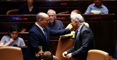 Israeli Prime Minister Naftali Bennett (L) and Foreign Minister Yair Lapid attend a session at the Knesset, Israel, June 30, 2022. (Reuters Photo)