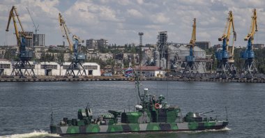 A picture taken during a visit to Mariupol organized by the Russian military shows a Russian navy ship on guard in the cargo sea port of Mariupol, Ukraine, June 12, 2022. (EPA Photo)