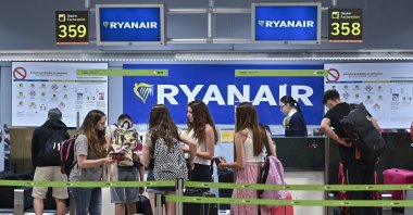 Travelers wait near a Ryanair check-in desk during the first day of a strike called by Ryanair crew, at Adolfo Suarez Madrid Barajas International Airport, in Madrid, Spain, June 24, 2022. (EPA Photo)