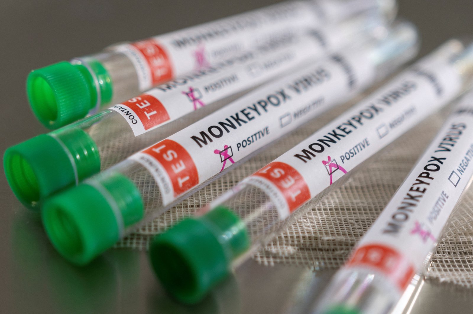 Test tubes labelled "Monkeypox virus positive" are seen in this illustration taken May 22, 2022. (Reuters Photo) 