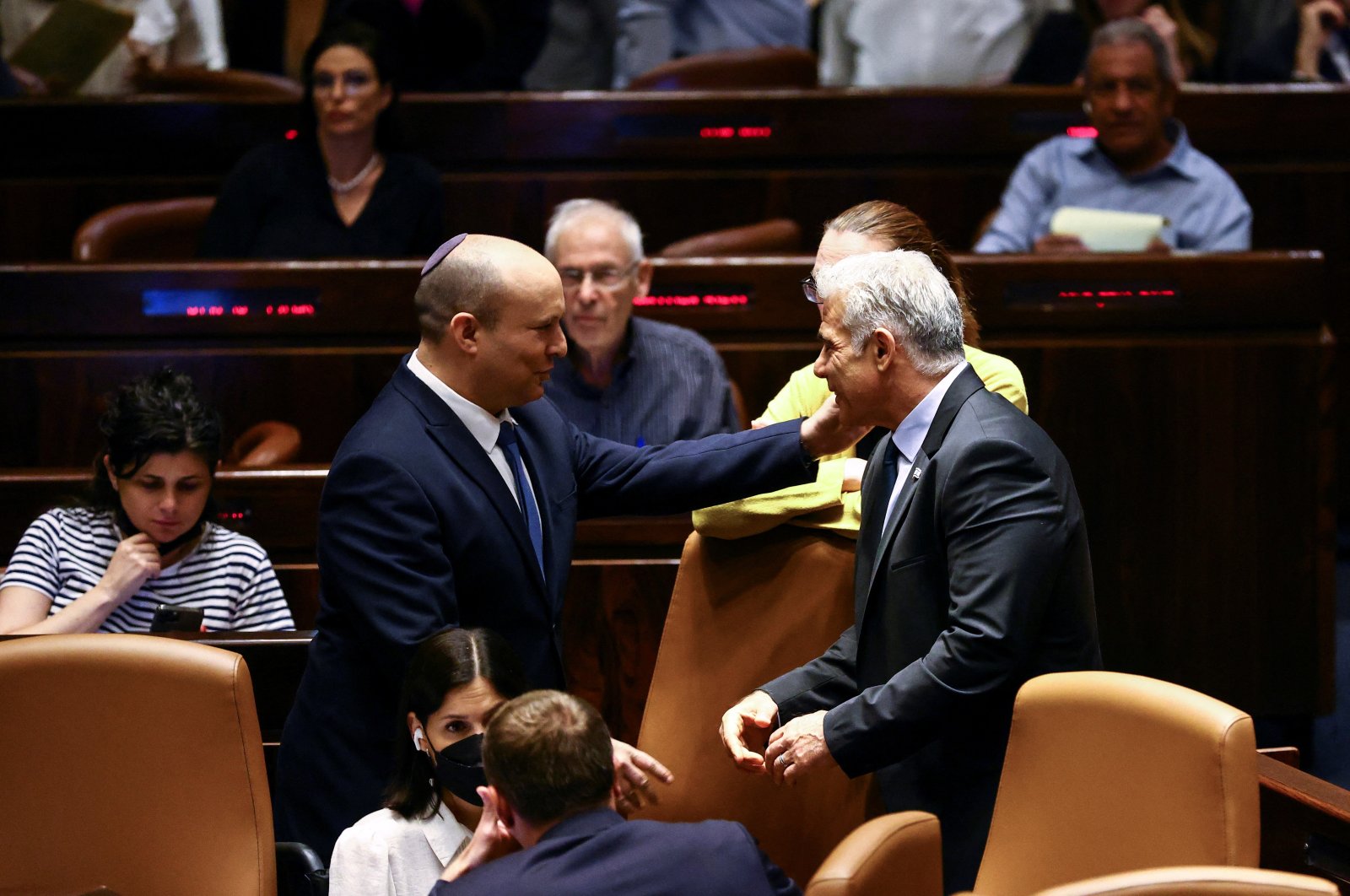 Israeli Prime Minister Naftali Bennett (L) and Foreign Minister Yair Lapid attend a session at the Knesset, Israel, June 30, 2022. (Reuters Photo)