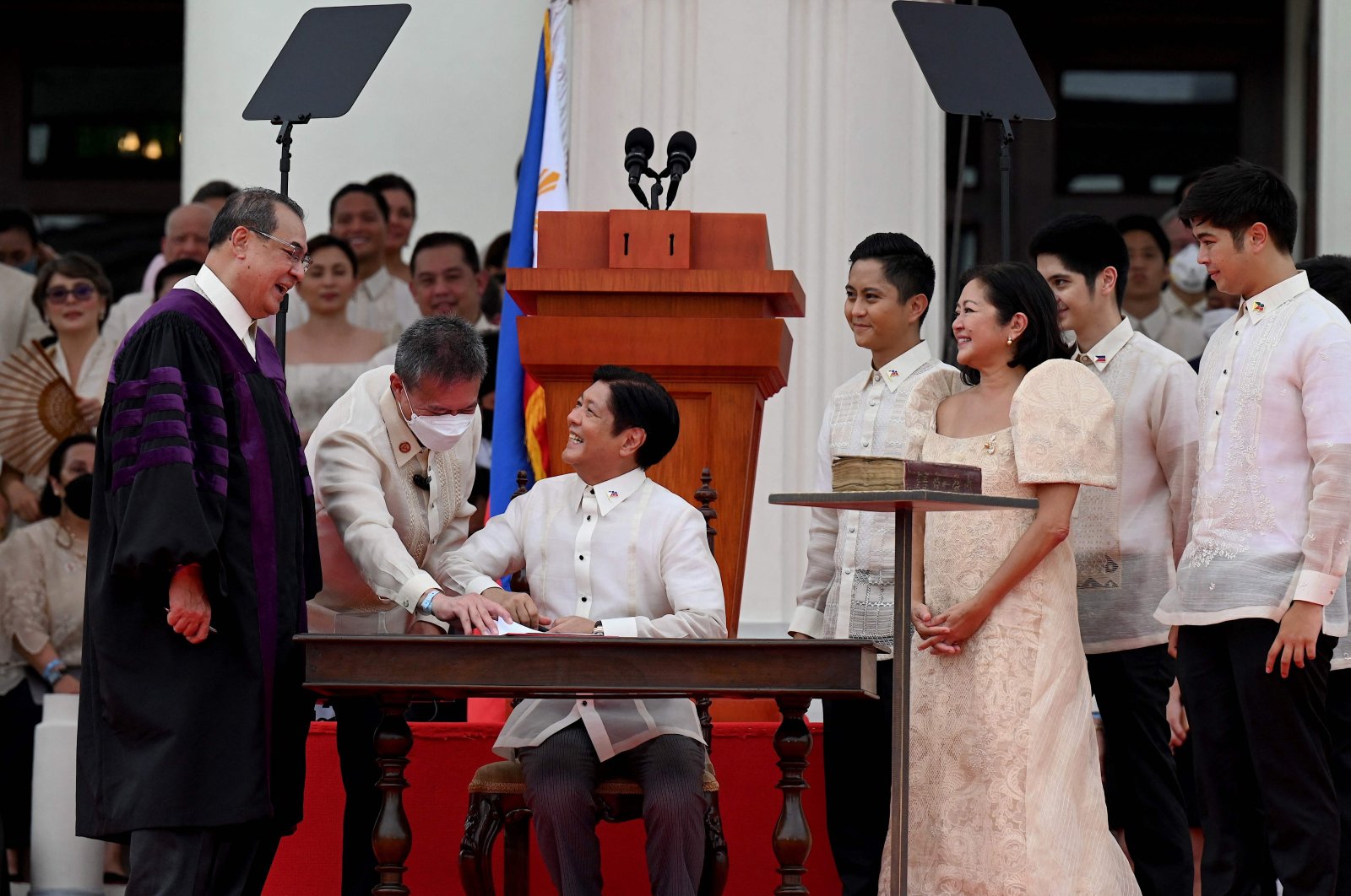 Ferdinand Marcos Jr. (seated C) is sworn in as the new president of the Philippines, Manila, Philippines, June 30, 2022. (AFP Photo)
