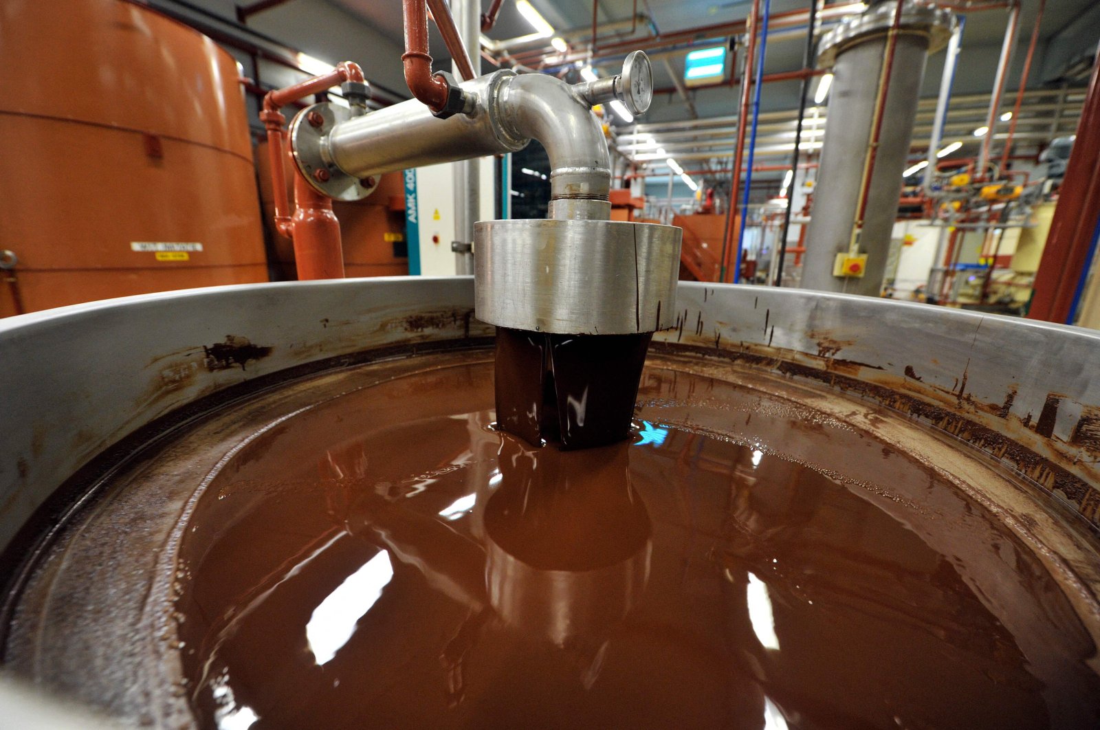 Hot chocolate before being moulded at the Barry Callebaut chocolate factory in Wieze, eastern Flanders, Belgium, July 8, 2013. (AFP Photo) 