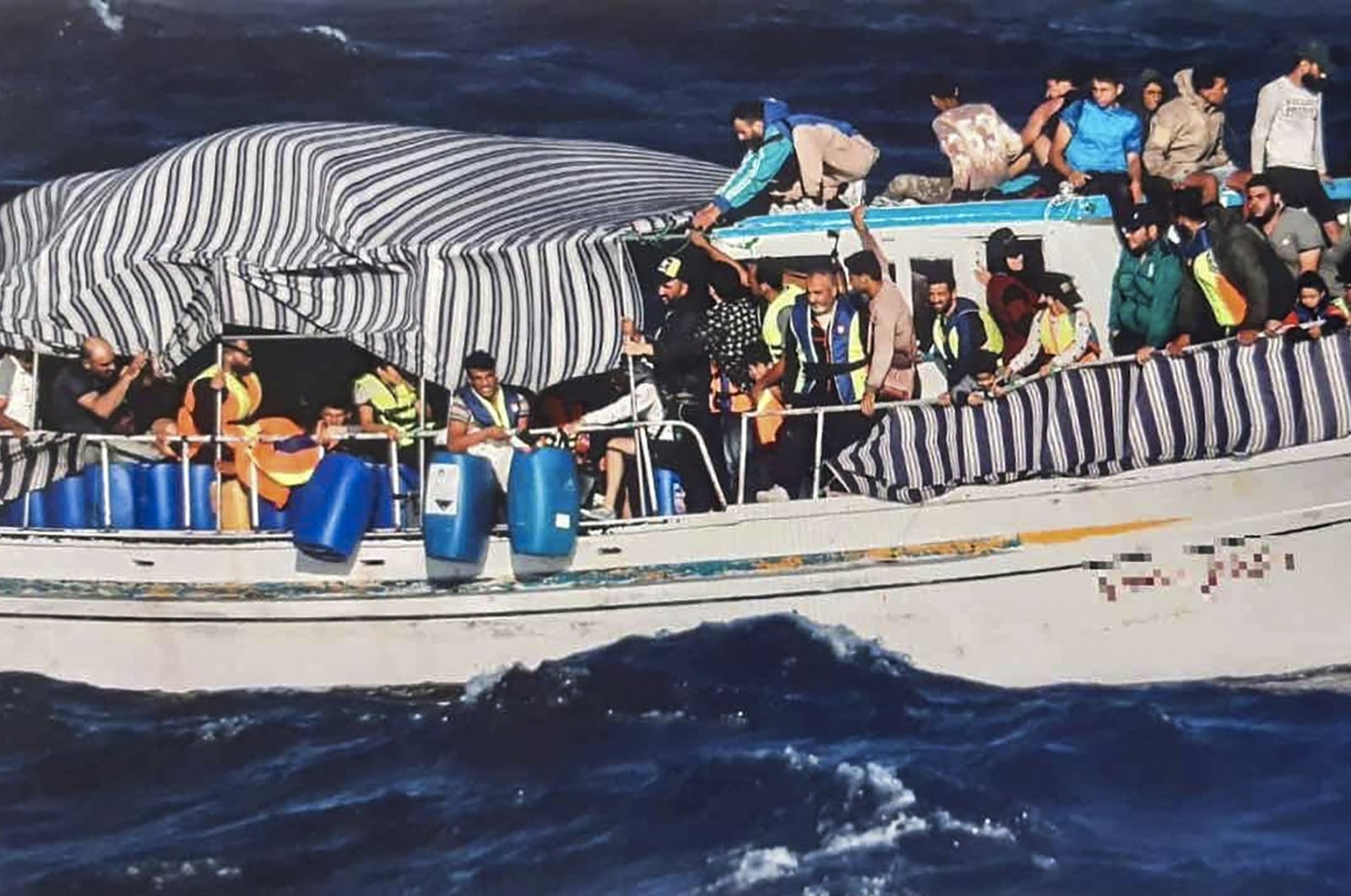 Migrants on a boat during a search and rescue operation off Karpathos island, Greece, June 28, 2022. (AFP)
