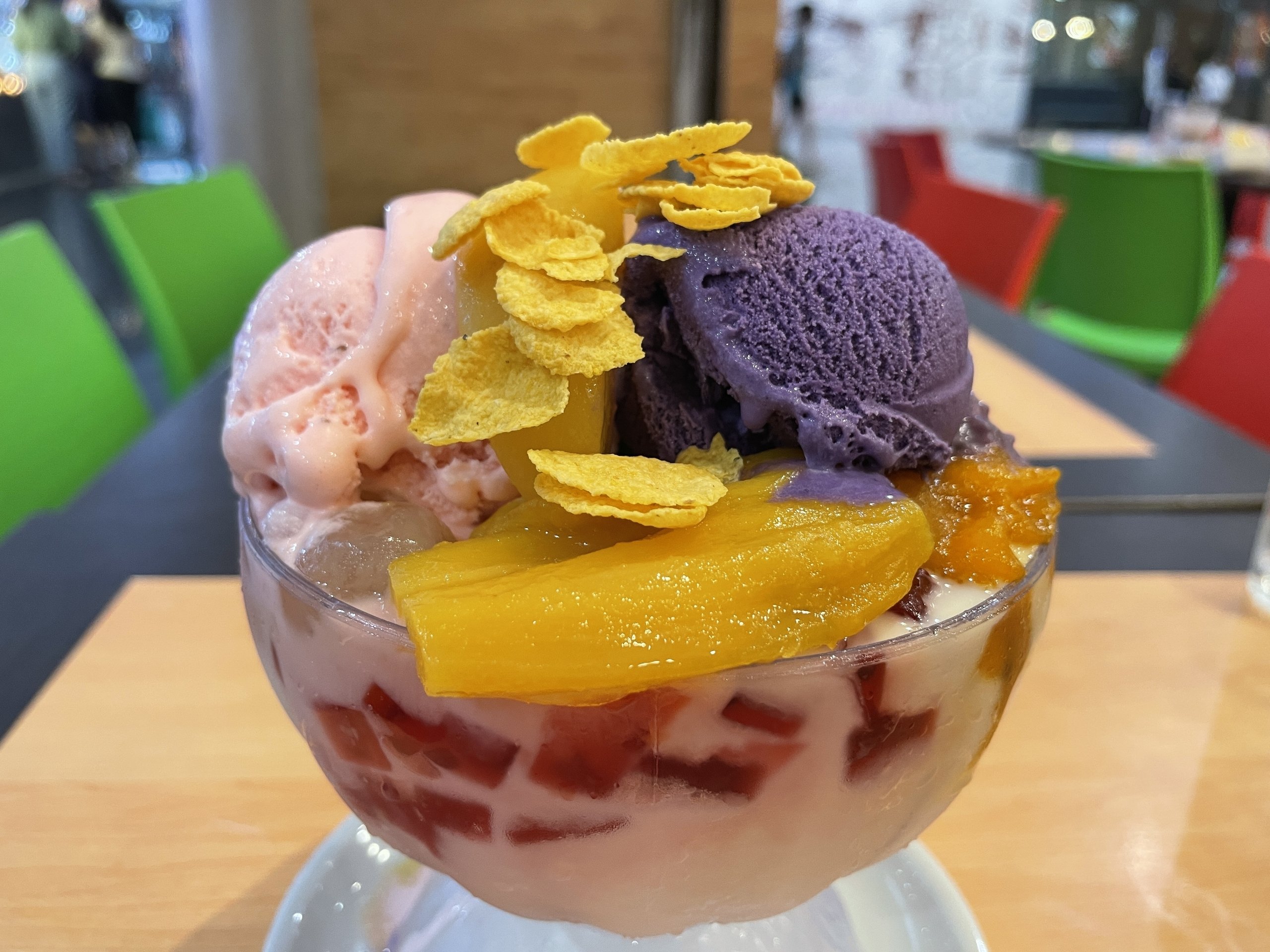 Halo-halo is a popular Filipino dessert and drink at the same time. Sweetened fruits such as bananas or coconut strips, candied mung or kidney beans and red and green jelly pieces are covered with scraped ice, June 14, 2022. (DPA Photo)
