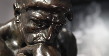 This photograph taken on June 28, 2022, shows a copy of &#039;The Thinker,&#039; a sculpture by French artist Auguste Rodin (1840-1917) on display in Paris, France. (AFP)