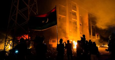 Protesters set fire to the Libyan parliament building after protests against the failure of the government in Tobruk, Libya, July 1, 2022. (Reuters Photo)