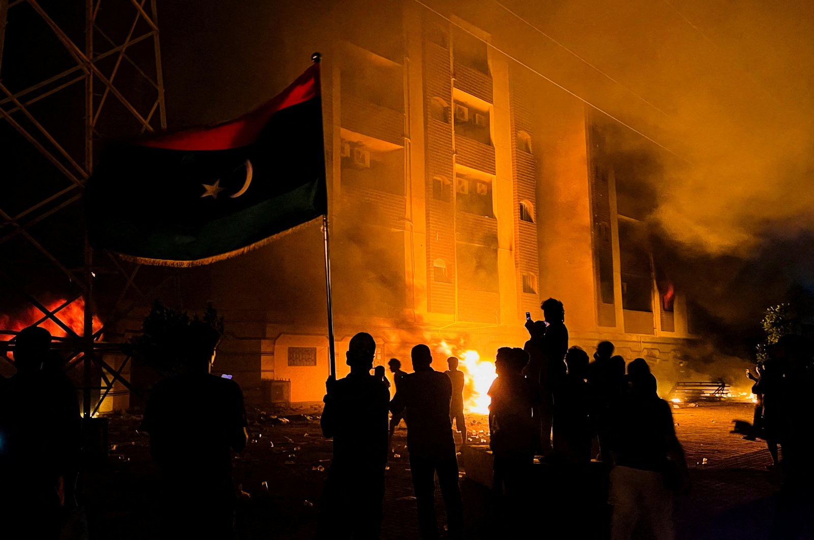 Protesters set fire to the Libyan parliament building after protests against the failure of the government in Tobruk, Libya, July 1, 2022. (Reuters Photo)