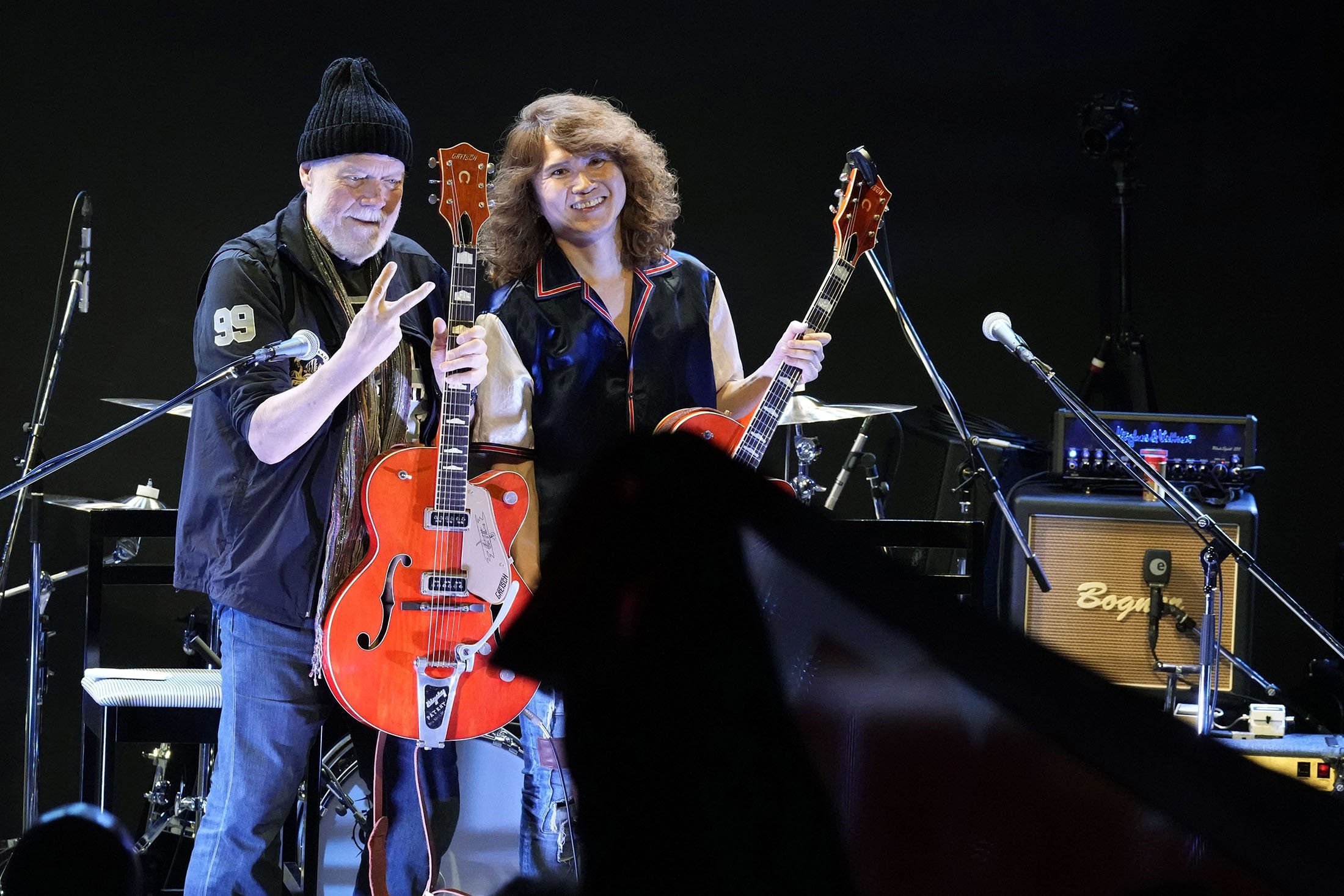 Canadian rock legend Randy Bachman, holding his reunited Gretsch guitar, poses with Japanese musician, TAKESHI during the Lost and Found Guitar Exchange Ceremony, at Canadian Embassy in Tokyo, Japan, July 1, 2022. (AP Photo)
