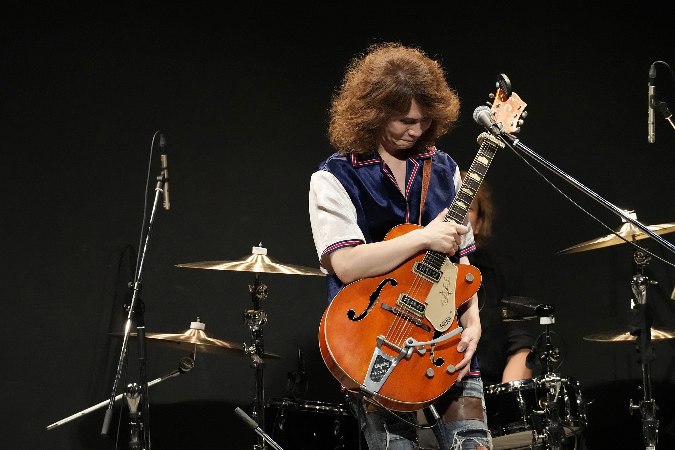Japanese musician TAKESHI holds his guitar which was found out as a stolen Gretsch guitar of Canadian rock legend Randy Bachman before returning it to Bachman during the Lost and Found Guitar Exchange Ceremony, at Canadian Embassy in Tokyo, Japan, July 1, 2022. (AP Photo)