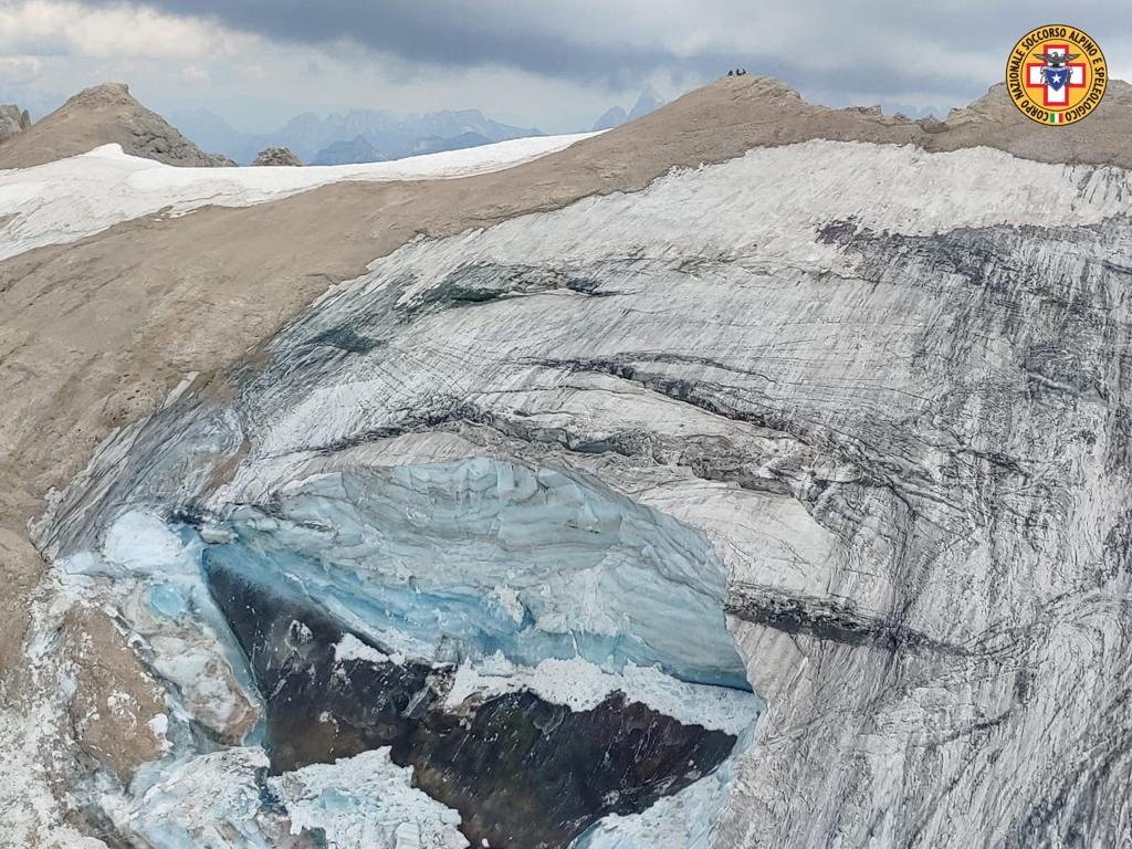 A handout photo from Alpine rescue services shows where an ice glacier collapsed on Marmolada mountain, Italy, July 3, 2022. (Reuters Photo)