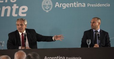 Argentinian President Alberto Fernandez (L) speaks next to then-Economy Minister Martin Guzman during an announcement in Buenos Aires, Argentina, June 6, 2022. (AP Photo)