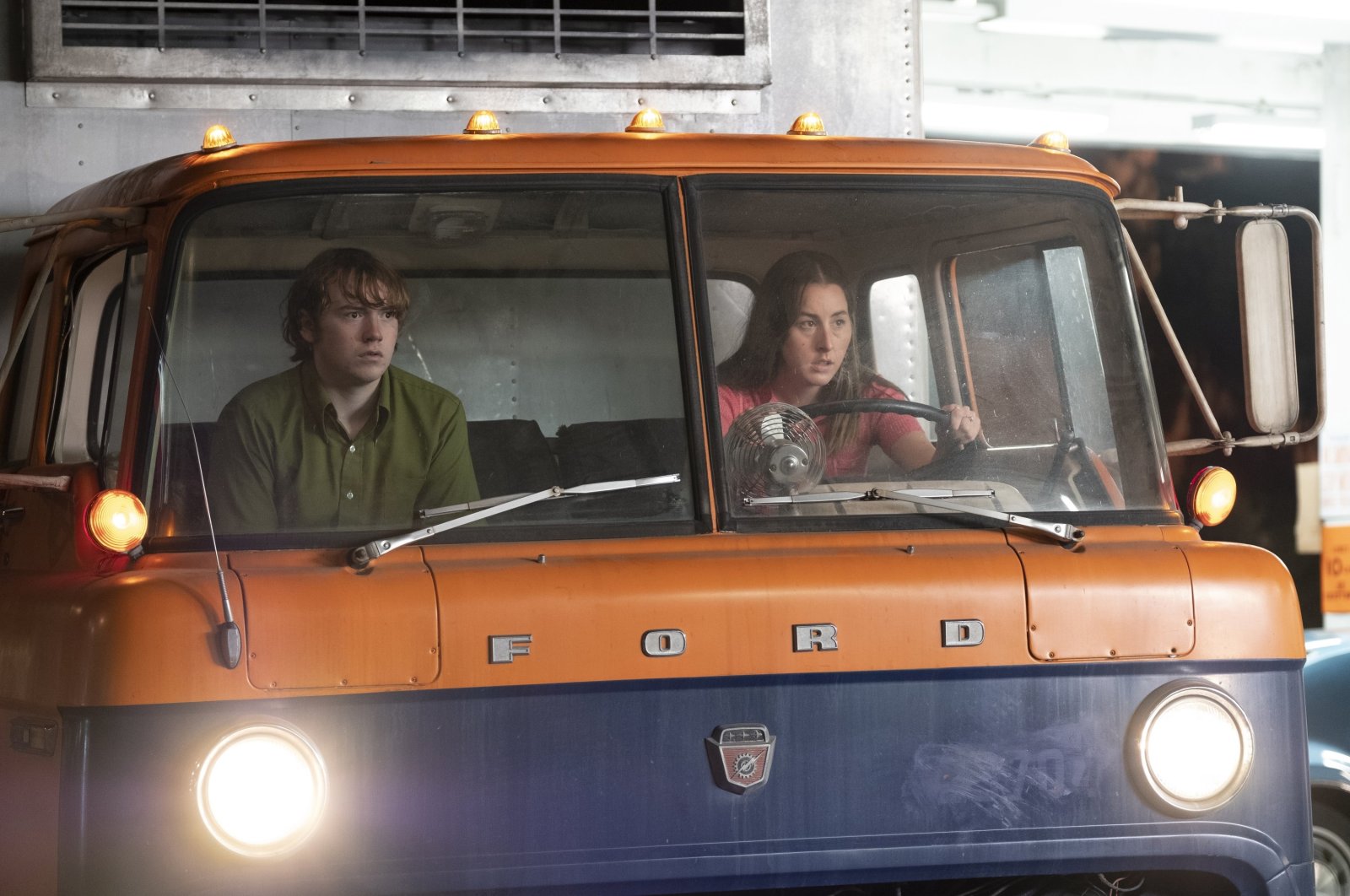 This image released by MGM shows Cooper Hoffman (L) and Alana Haim in a scene from the film "Licorice Pizza." (AP Photo)