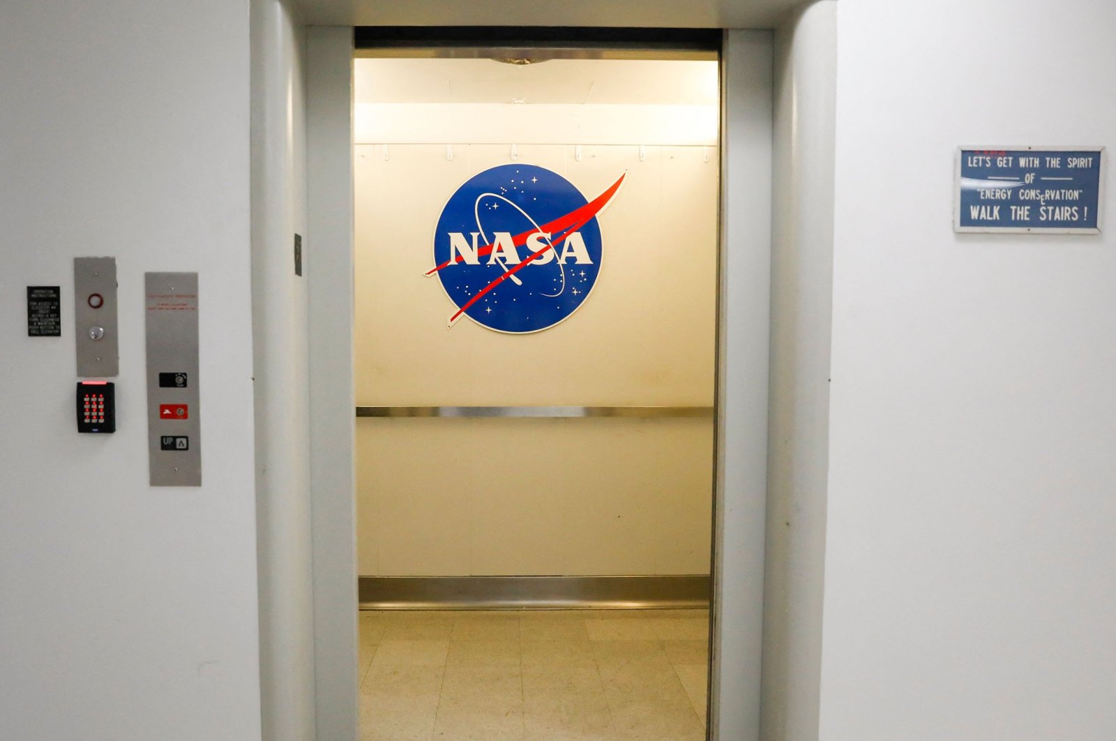 A NASA sign in an elevator at the Astronaut Crew Quarters (ACQ) in the Neil Armstrong Operations and Checkout Building at Kennedy Space Center, Cape Canaveral, Florida, U.S., June 14, 2022. (AFP Photo)