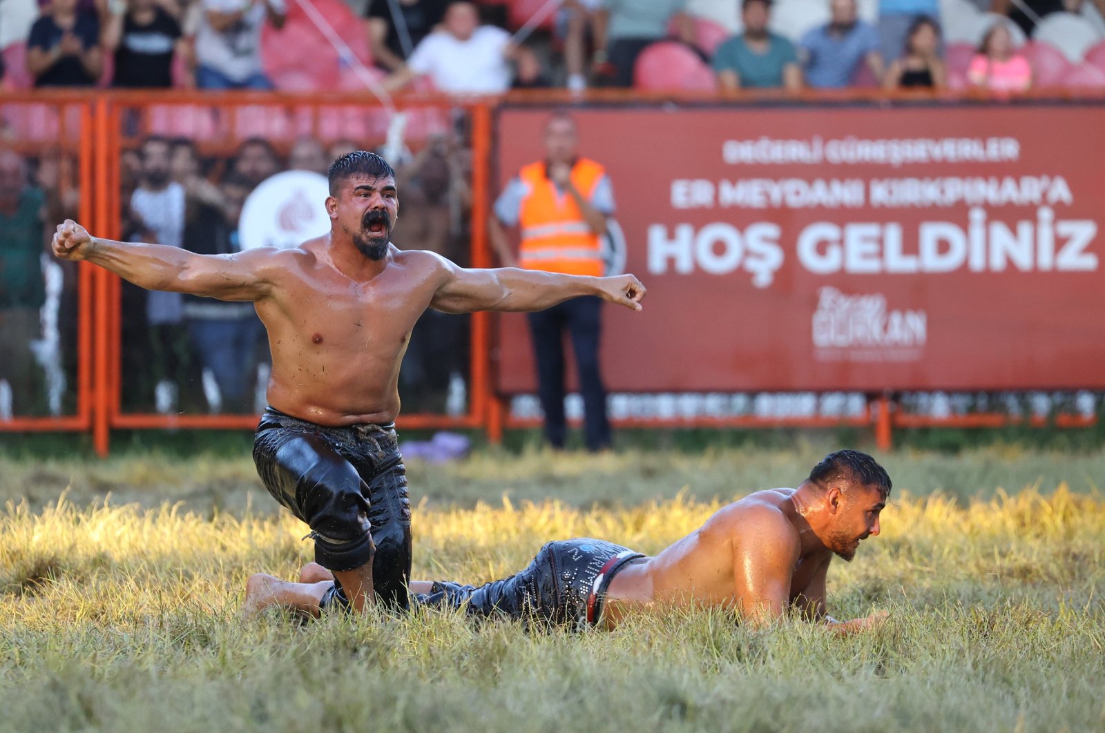 Cengizhan Şimşek (L) celebrates winning the top title at the 661st Kırkpınar Oil Wrestling Festival, Edirne, Turkey, July 3, 2022. (AA Photo)