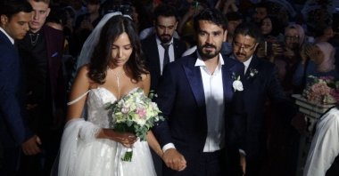 Man City's İlkay Gündoğan (R) and wife Sara Arfaoui (L) arrives at the wedding, Balıkesir, Turkey, July 3, 2022. (DHA Photo)