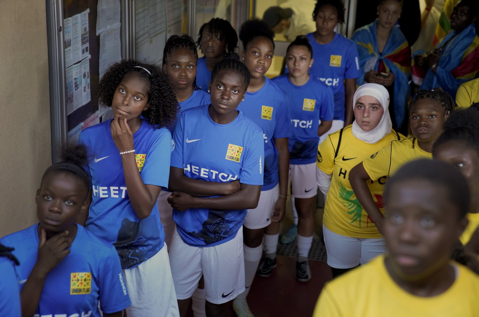 Players wait before entering the field prior to the final women&#039;s game of the national cup of working-class neighborhoods between a team representing players with Malian heritage against one with Congolese roots, in Creteil, France, July 2, 2022. (AP Photo)
