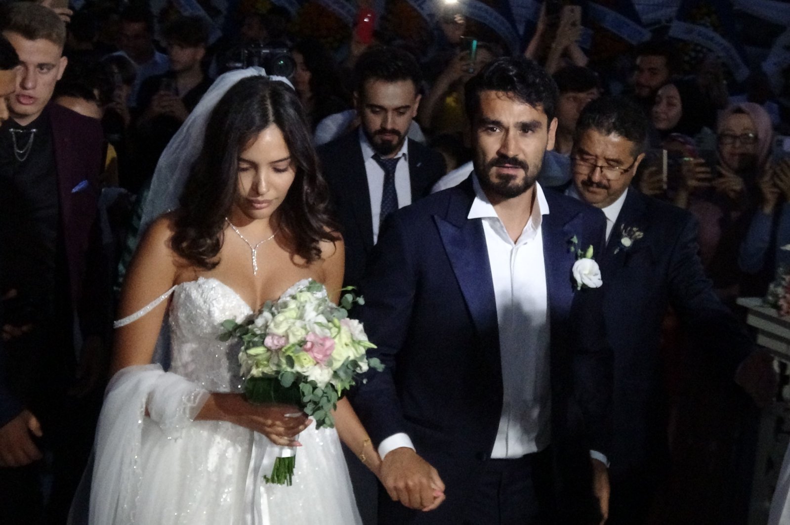Man City&#039;s İlkay Gündoğan (R) and wife Sara Arfaoui (L) arrives at the wedding, Balıkesir, Turkey, July 3, 2022. (DHA Photo)