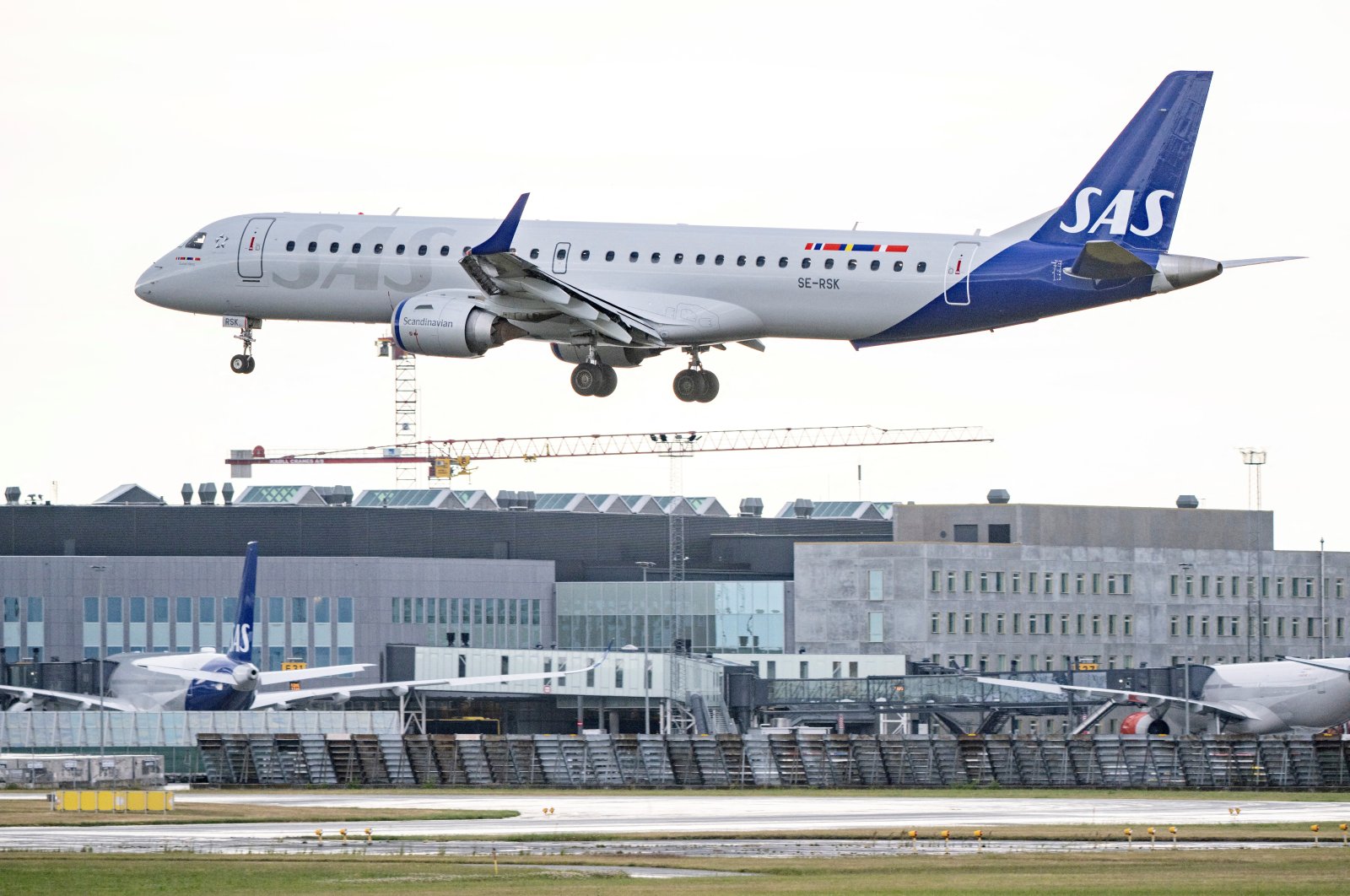 SAS Link&#039;s Embraer E195 aircraft lands at Kastrup Airport, as pilots of Scandinavian Airlines go on strike, in Kastrup, Denmark, July 4, 2022. (Reuters Photo)