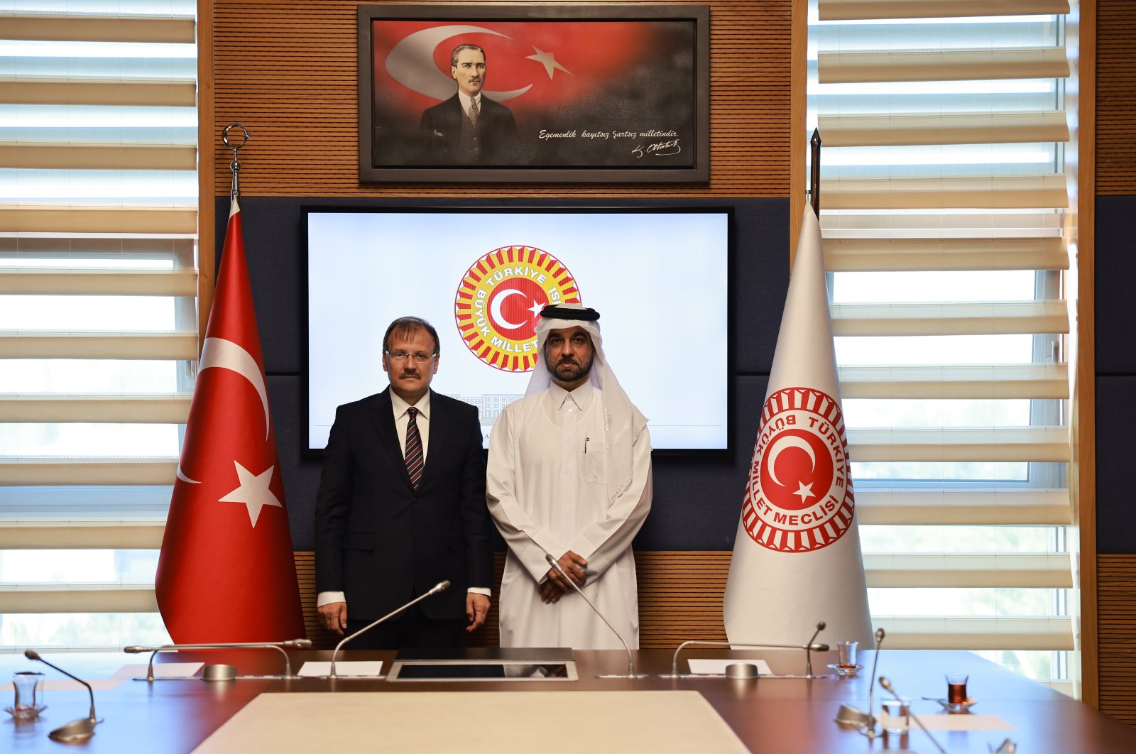 Chair of the Parliamentary Human Rights Investigation Committee Hakan Çavuşoğlu (L) receives Sultan bin Hassan Al Jamali, secretary-general of the Qatar National Human Rights Committee, in the capital Ankara, Turkey, July 5, 2022. (AA)